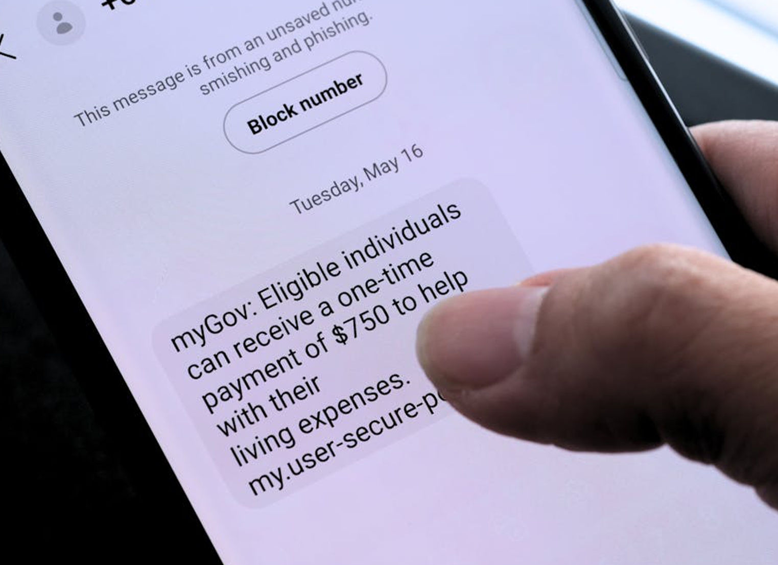 A mobile phone screen showing a myGov text message