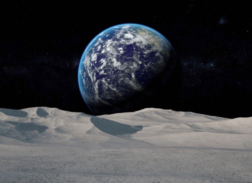 Moon surface in the foreground with the Earth in the far distance